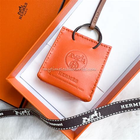 hermes orange bag charm.